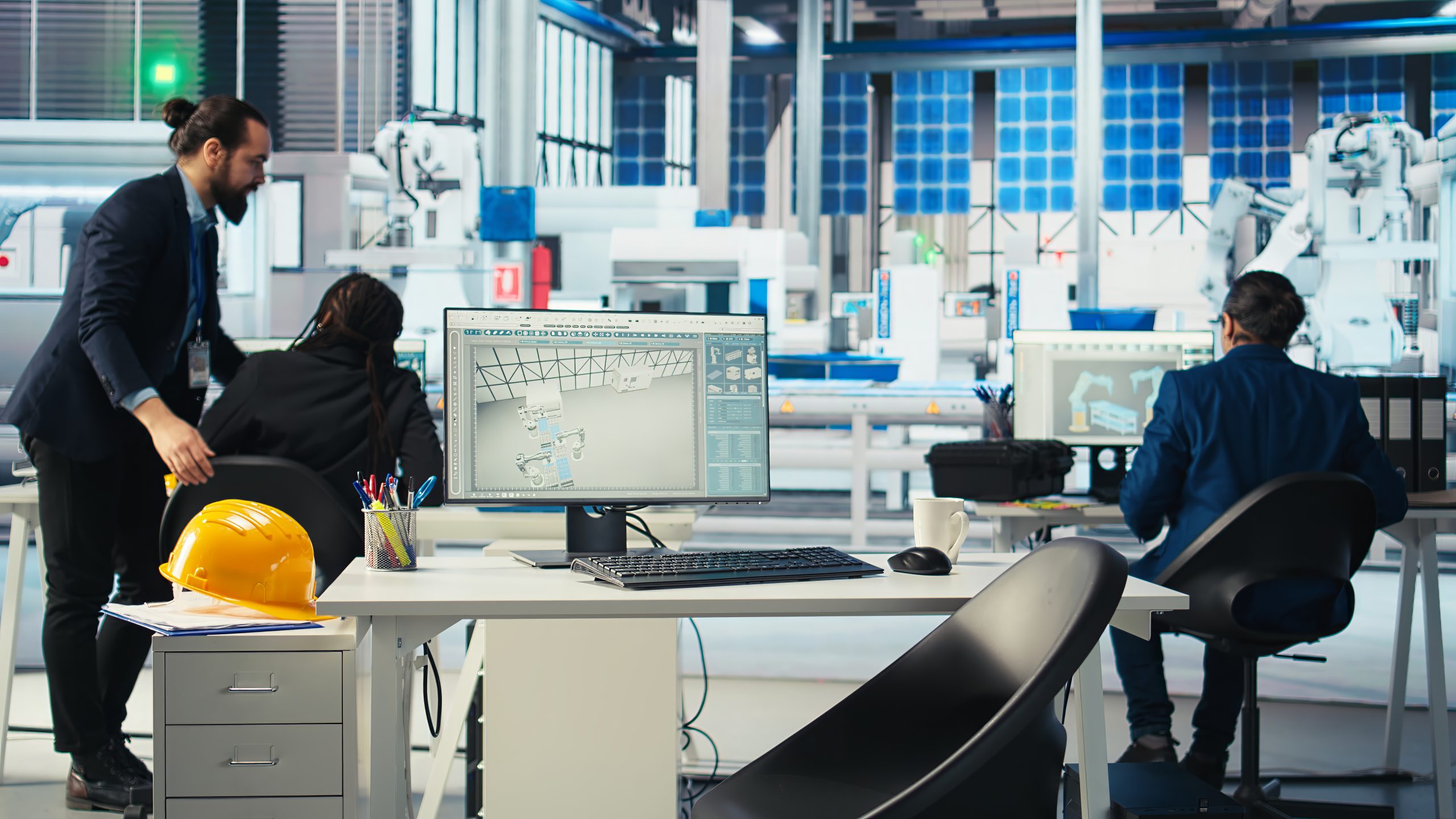 photovoltaics factory manager walking to employees desks to give tasks