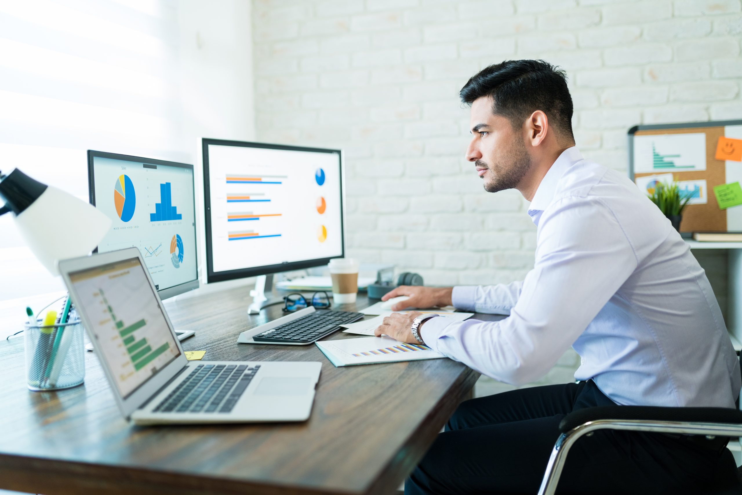 freelance salesman examining data at desk